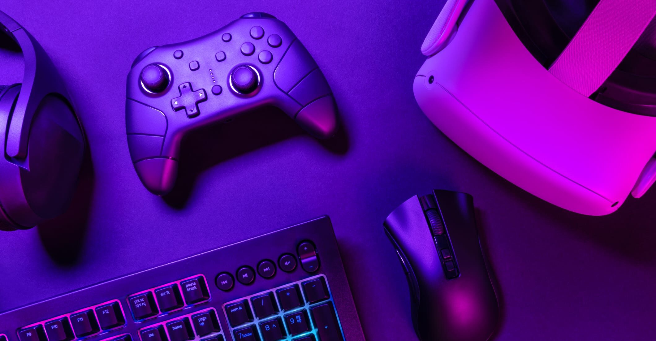Close-up of gaming controllers on a desk, representing video game user experience research