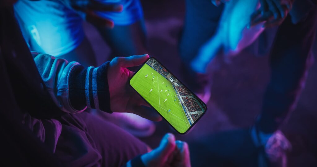 Players engaging with a mobile football game, showing in-game behaviour